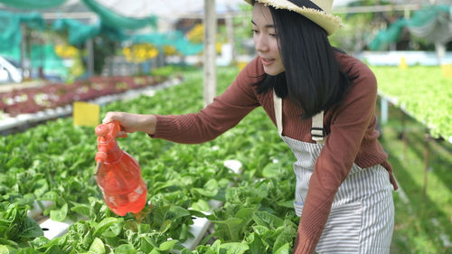 Midsection of woman holding food outdoors