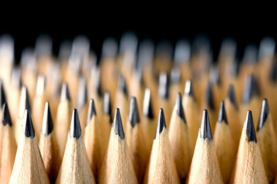 Close-up of colored pencils in row