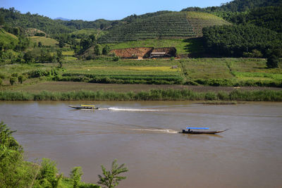 High angle view of abandoned boat on landscape against sky