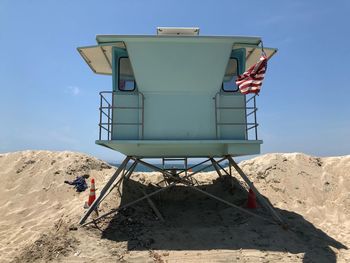 Low angle view of lifeguard hut against sky