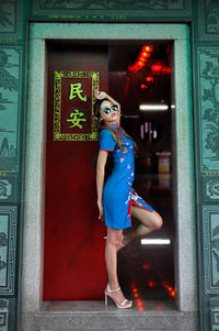 Asian nyonya female portrait in chinese traditional cheongsam, qipao photoshoot chinese new year