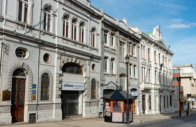 Street amidst buildings in city against sky