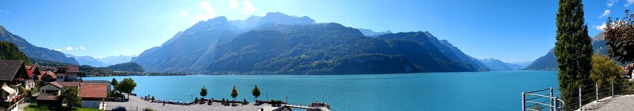 Panoramic view of sea and mountains against sky