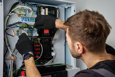 Side view of man working at home