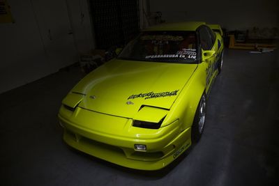 High angle view of yellow car on street at night
