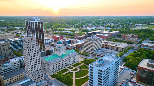 High angle view of cityscape against sky during sunset