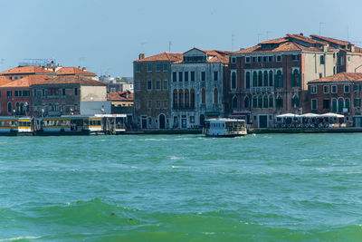 View of buildings against cloudy sky