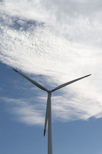 Low angle view of windmill against sky