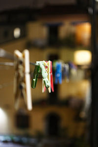 Close-up of clothespins hanging outdoors