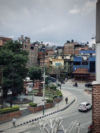 High angle view of buildings in city against sky