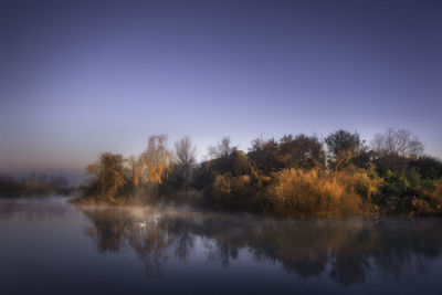 Scenic view of lake against sky during autumn