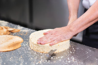 Cropped image of person preparing food