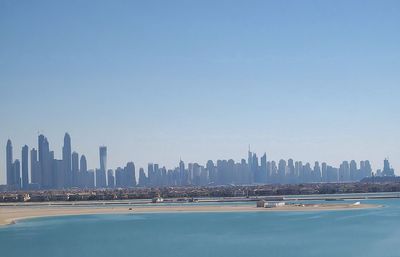 Modern cityscape against clear sky