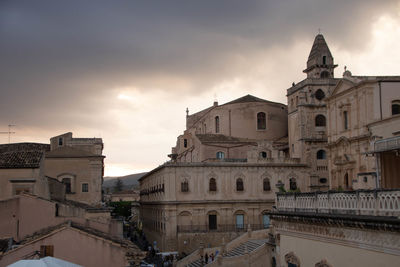 Buildings in city against sky