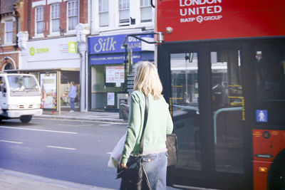 Woman looking at city street