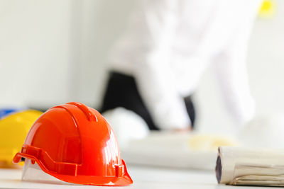 Close-up of red working on table