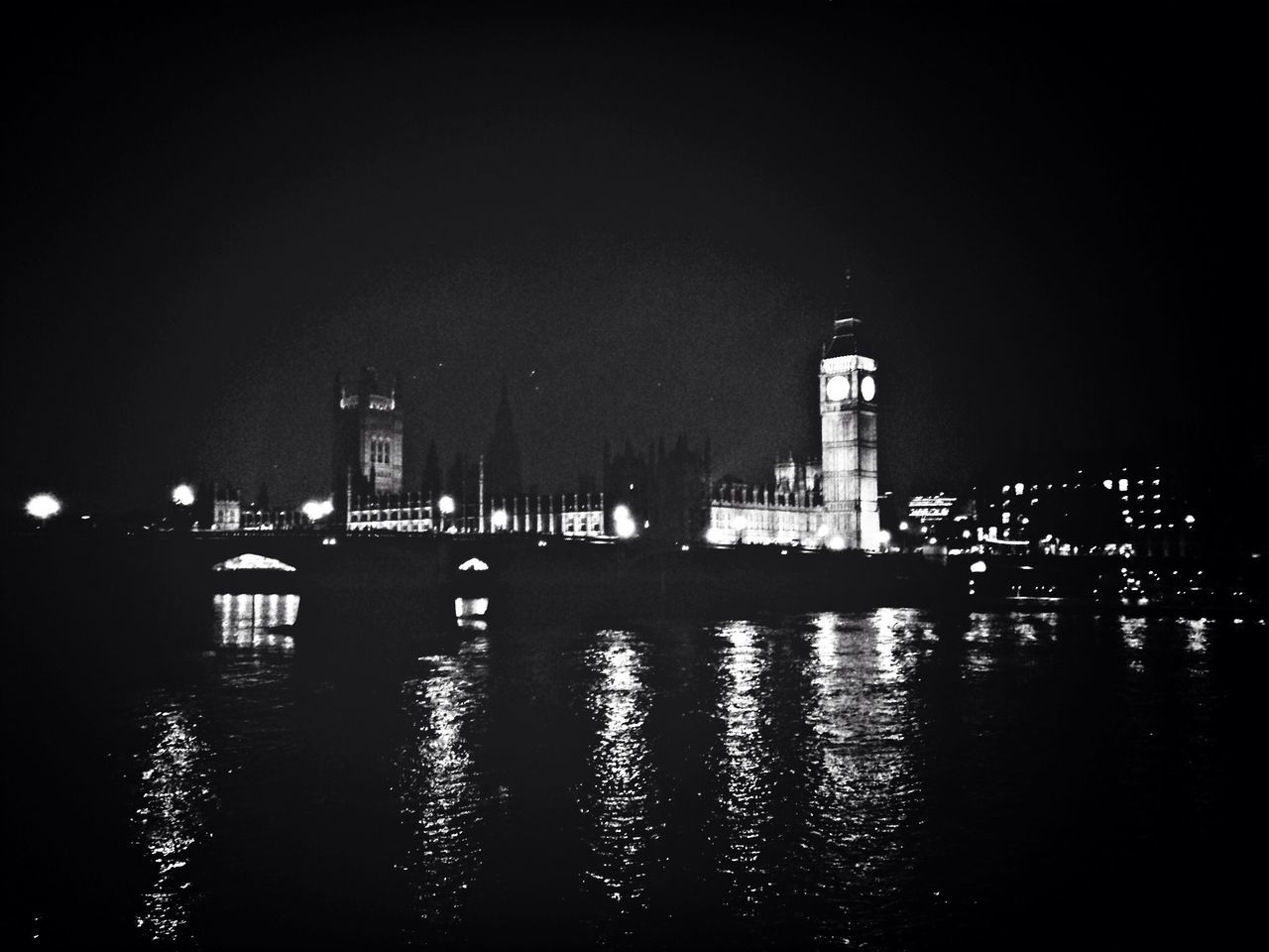 architecture, building exterior, built structure, city, illuminated, night, skyscraper, reflection, waterfront, water, cityscape, tower, modern, urban skyline, tall - high, office building, river, clear sky, sky, building