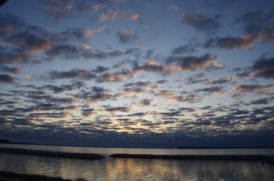 Scenic view of sea against sky at sunset