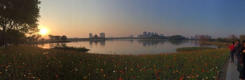 Panoramic view of cityscape against sky during sunset