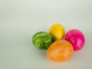 Close-up of multi colored candies against white background