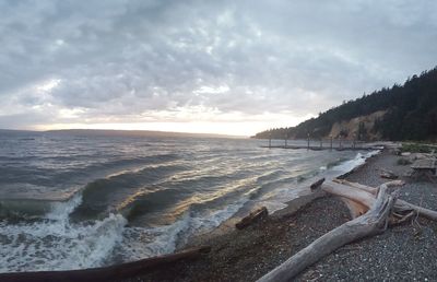 Scenic view of sea against cloudy sky