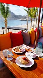 Table and chairs at beach