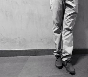 Low section of man standing on floor