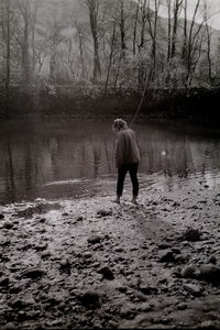 Rear view of man in forest