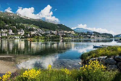 Scenic view of lake and mountains against sky