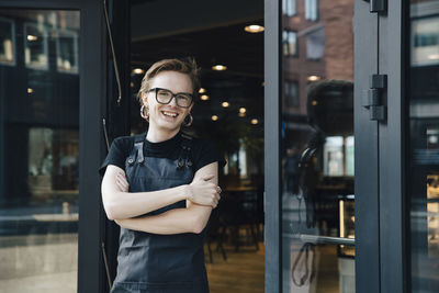 Portrait of smiling woman standing outdoors