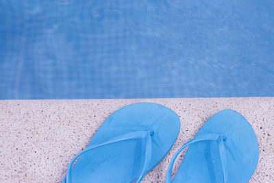 High angle view of shoes on beach