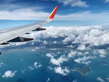 Aerial view of airplane flying in sky