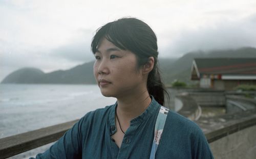 Portrait of young woman looking away