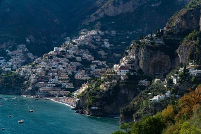 Aerial view of city by sea