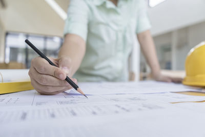 Midsection of woman working in office