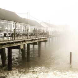 Pier over lake against sky