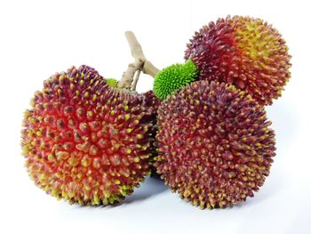 Close-up of fruits over white background