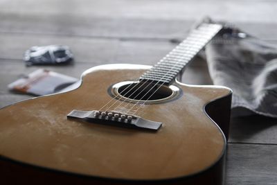 Close-up of guitar on table