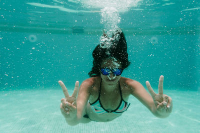 Portrait of a boy swimming in pool