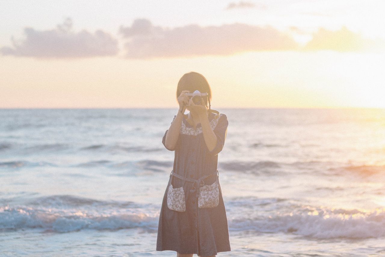 sea, standing, water, one person, sky, land, beach, real people, scenics - nature, beauty in nature, leisure activity, lifestyles, fashion, horizon, horizon over water, young women, women, young adult, adult, beautiful woman, outdoors