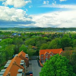 High angle view of town against cloudy sky