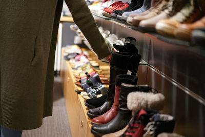 Low section of woman standing in store