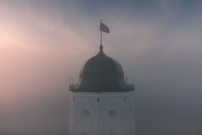 Aerial view of the fog-shrouded tower of st. olaf in the vyborg castle. cultural heritage of russia