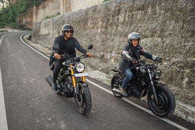 Man riding motorcycle on road