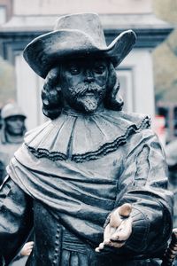 Close-up of statue of man in city