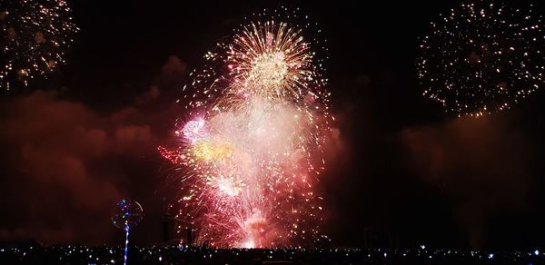 Firework display at night