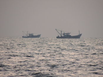 Ship in sea against sky