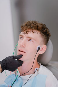 Patient on transcutaneous electrical nerve stimulation before braces fixation.