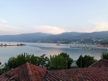 Panoramic shot of townscape by lake against sky