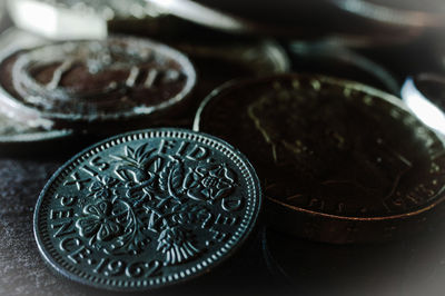 Close-up of old coins on table